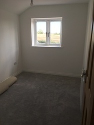 Bedroom 2, from landing, showing view to east